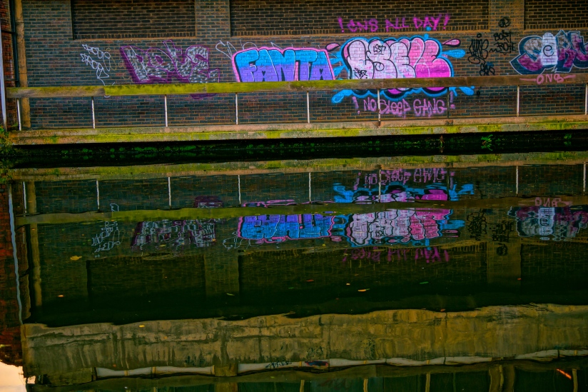 Graffiti reflected at Ludgate Hill canal, Birmingham, UK. . . 